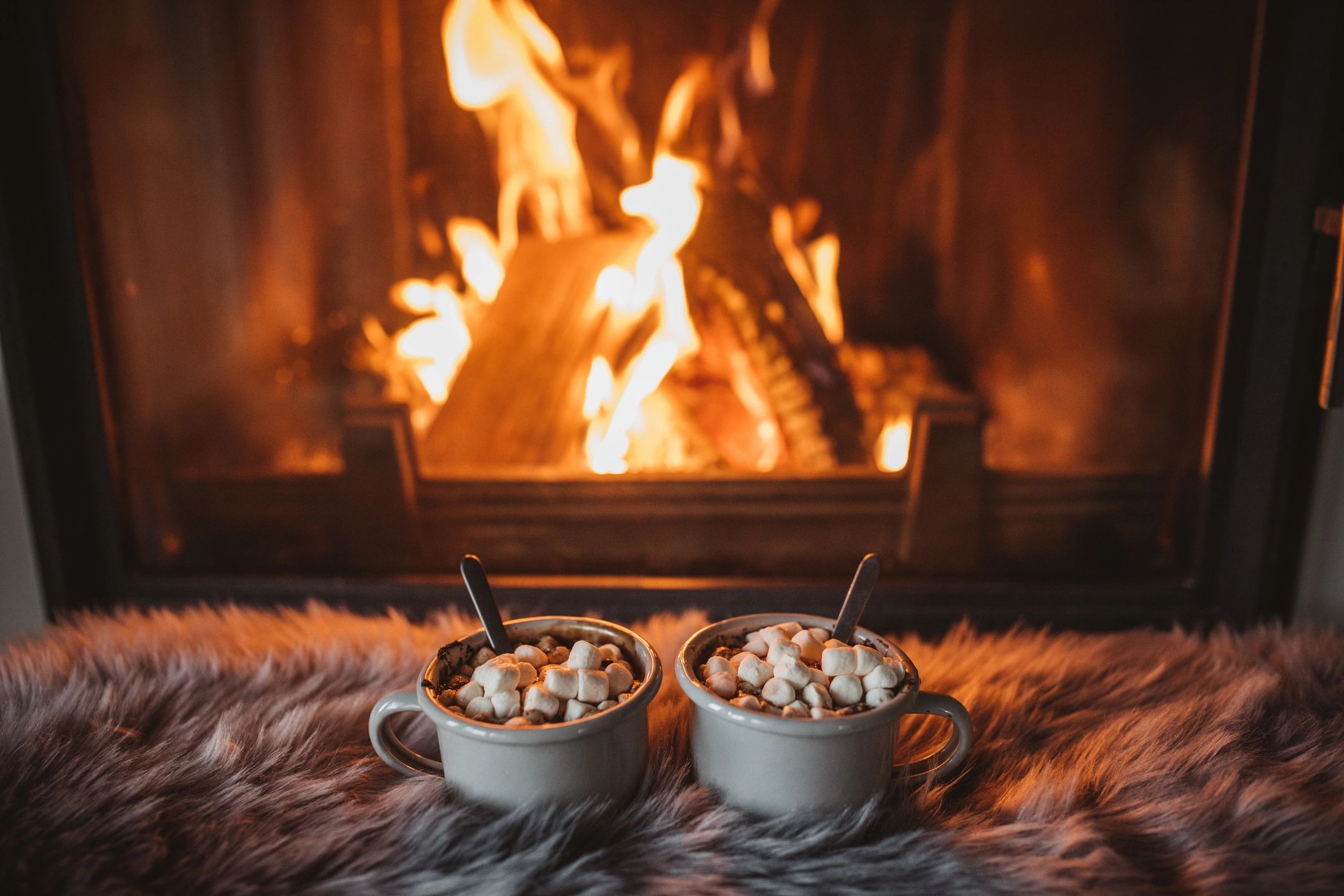 Hot cocoa by a fireplace
