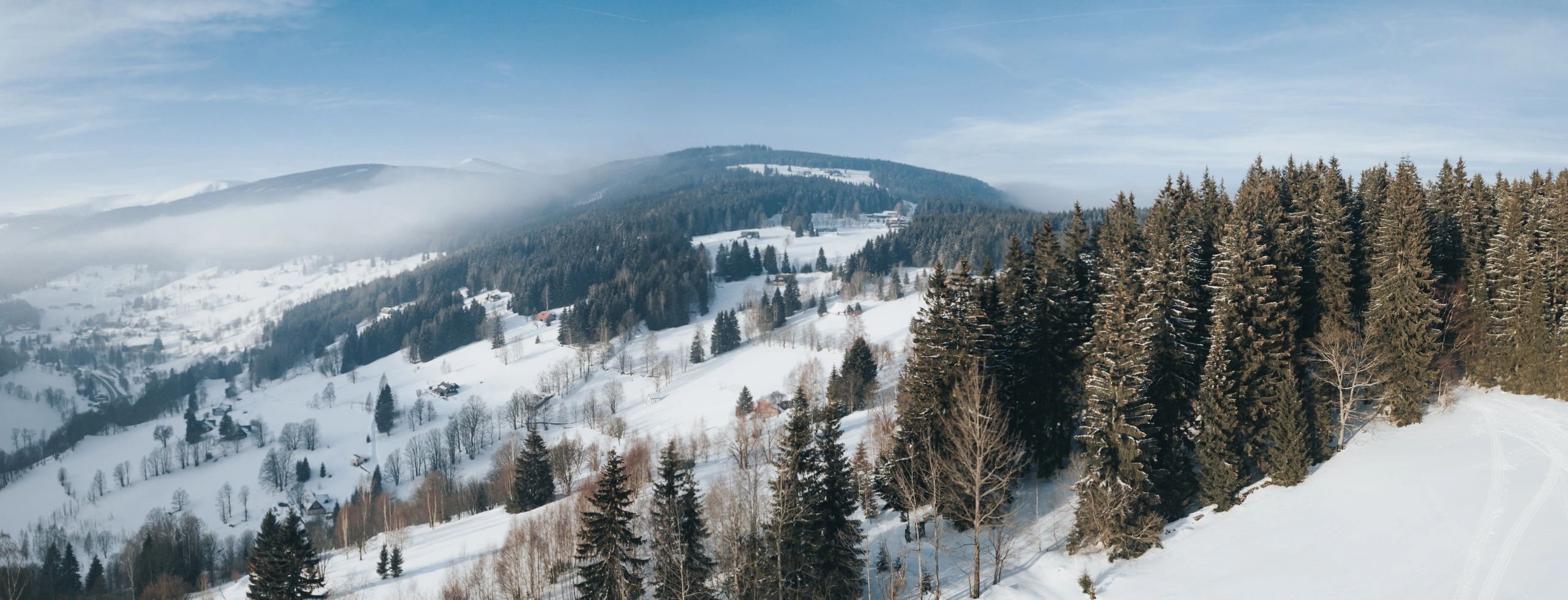 Panoramic view of snowy winter mountains