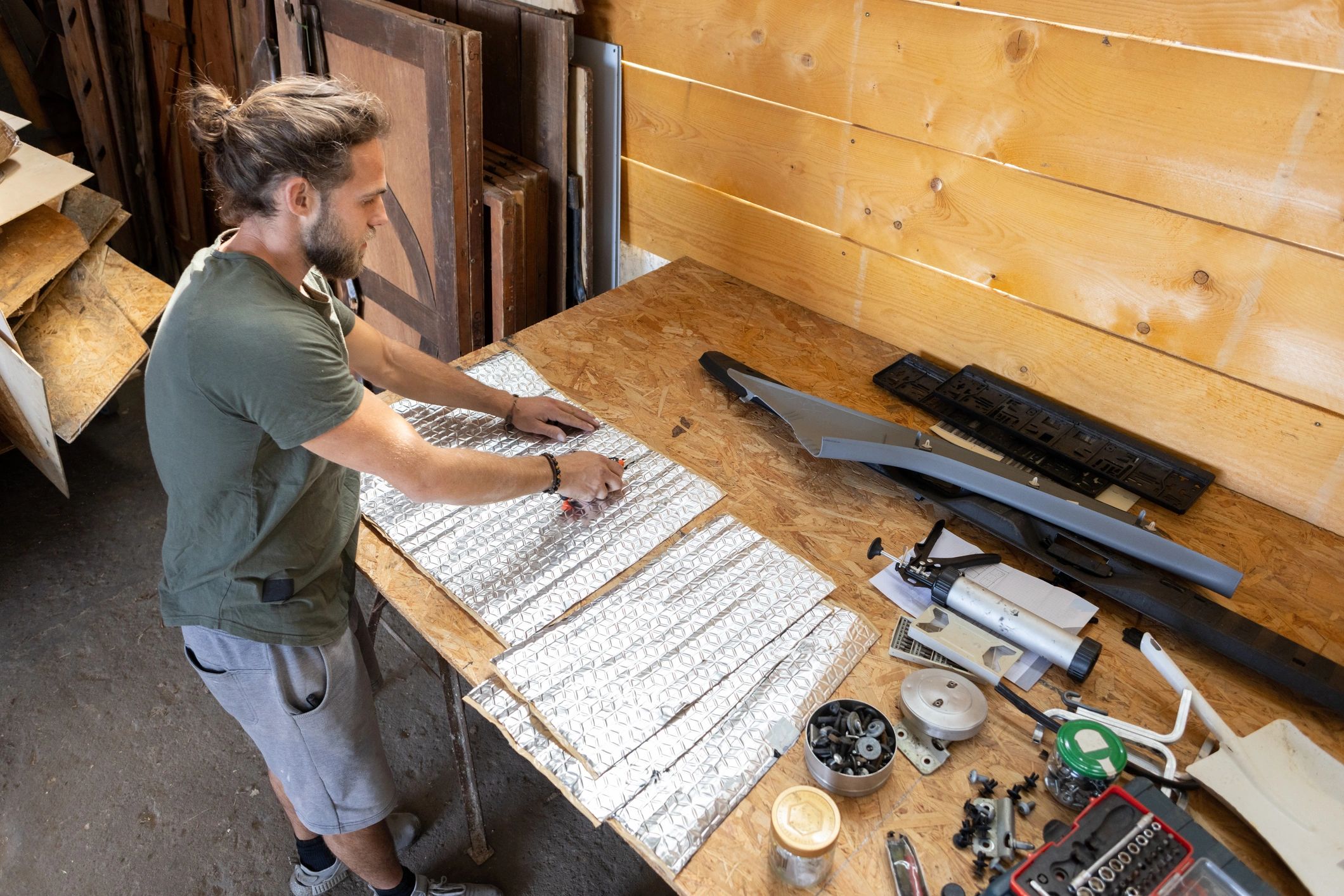 Technician working at a bench with tools