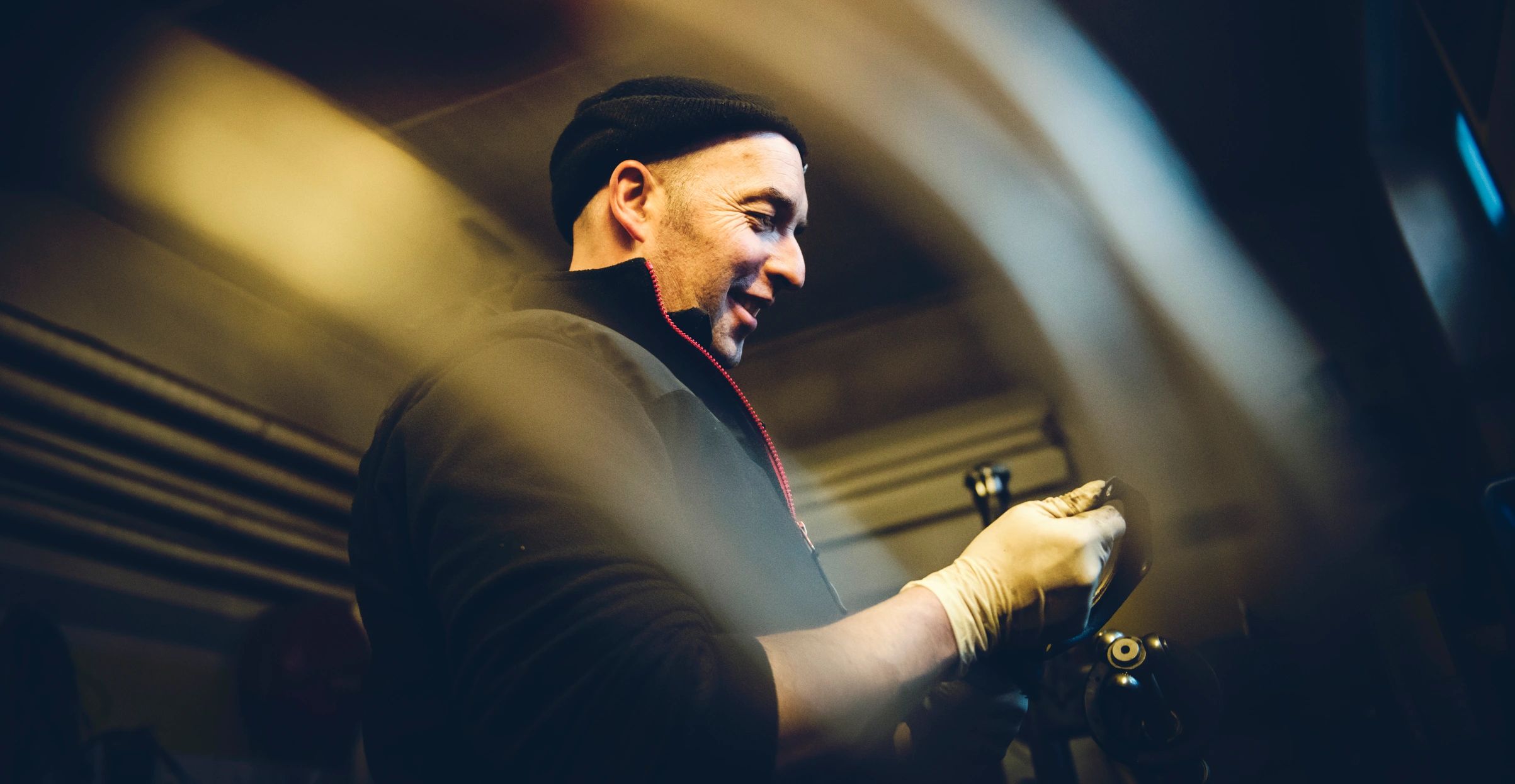 Technician working on equipment in a workshop